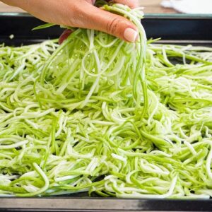 Better than pizza! Simply grate two zucchini and pop them in the oven! Zucchini Pizza