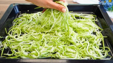 Better than pizza! Simply grate two zucchini and pop them in the oven! Zucchini Pizza
